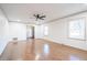 Spacious living room with hardwood floors, ample natural light, and a ceiling fan at 2804 Edgewood Ave, Burlington, NC 27215