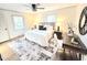 Stylish bedroom with ceiling fan, a bed with nightstands, and a decorative rug at 2804 Edgewood Ave, Burlington, NC 27215