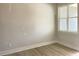 Bright bedroom featuring new, light wood flooring and large windows allowing natural light at 478 Traditions Grande Blvd # 32, Wake Forest, NC 27587