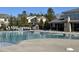 Community pool with chairs and tables for relaxing at 478 Traditions Grande Blvd # 32, Wake Forest, NC 27587