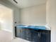 Bathroom vanity featuring dark cabinetry and ample counter space at 478 Traditions Grande Blvd # 32, Wake Forest, NC 27587