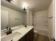 Modern bathroom features a double sink vanity, white countertops, and a shower and tub combo at 482 Traditions Grande Blvd # 30, Wake Forest, NC 27587