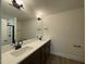 A bathroom featuring a double sink vanity, white countertops, and a shower with glass door at 482 Traditions Grande Blvd # 30, Wake Forest, NC 27587