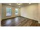 The primary bedroom features hardwood floors and natural light at 482 Traditions Grande Blvd # 30, Wake Forest, NC 27587