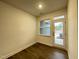 Spacious bonus room with hardwood floors, natural light, and back patio access at 482 Traditions Grande Blvd # 30, Wake Forest, NC 27587