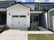 Charming townhouse featuring a one-car garage and welcoming entrance at 482 Traditions Grande Blvd # 30, Wake Forest, NC 27587