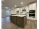 Open concept kitchen featuring a large island, stainless appliances, and modern finishes at 482 Traditions Grande Blvd # 30, Wake Forest, NC 27587