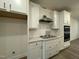 Bright kitchen showcasing stainless steel appliances, gas cooktop, and sleek white cabinetry at 482 Traditions Grande Blvd # 30, Wake Forest, NC 27587