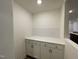 Walk-in pantry with white cabinets and drawers for optimal storage at 482 Traditions Grande Blvd # 30, Wake Forest, NC 27587