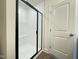 Modern shower with a black framed glass door and white tiled walls including a built-in soap niche at 482 Traditions Grande Blvd # 30, Wake Forest, NC 27587
