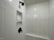 Bright, fully tiled shower featuring a bench and built-in soap niche at 482 Traditions Grande Blvd # 30, Wake Forest, NC 27587