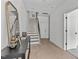Entryway with hardwood floors, stairs, and a dark wood console table at 6420 Tanner Oak Ln, Raleigh, NC 27613