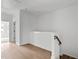 Bright hallway with light wood floors and staircase at 6420 Tanner Oak Ln, Raleigh, NC 27613