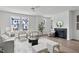 Cozy living room with a fireplace, modern decor, and ample natural light, creating a welcoming atmosphere at 6420 Tanner Oak Ln, Raleigh, NC 27613
