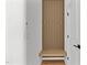 Mud room with wooden bench and coat hooks at 6420 Tanner Oak Ln, Raleigh, NC 27613