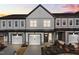 New two-story townhome at sunset with a two car garage and light gray and white paint at 703 Jamescroft Way, Rolesville, NC 27587