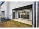A covered patio with sliding glass doors offers seamless indoor-outdoor living space at 707 Jamescroft Way, Rolesville, NC 27587