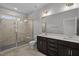 Bathroom featuring double sink vanity and a walk-in shower at 707 Jamescroft Way, Rolesville, NC 27587