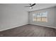 Empty bedroom featuring hardwood floors, a window that provides plenty of natural light, and neutral walls at 707 Jamescroft Way, Rolesville, NC 27587