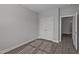 A cozy bedroom features a double door closet, base trim and modern flooring at 707 Jamescroft Way, Rolesville, NC 27587