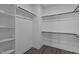 A well-lit closet featuring wooden rails and built-in white shelving for ample storage at 707 Jamescroft Way, Rolesville, NC 27587