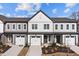 Attractive newly built townhomes boast neutral siding, matching garages and professionally landscaped yards at 707 Jamescroft Way, Rolesville, NC 27587