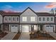 Attractive newly built townhomes boast neutral siding, matching garages and professionally landscaped yards at 707 Jamescroft Way, Rolesville, NC 27587