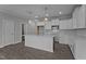 Bright kitchen featuring white cabinets, stainless steel appliances, and a central island with pendant lighting at 707 Jamescroft Way, Rolesville, NC 27587