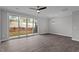 Spacious living room features hardwood floors and a sliding glass door that opens to the backyard at 707 Jamescroft Way, Rolesville, NC 27587
