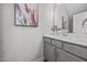 Bathroom featuring a white vanity, framed mirror, neutral paint, and decorative accents at 709 Jamescroft Way, Rolesville, NC 27587