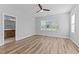 Bedroom featuring wood floors and a window, connected to a full bathroom at 709 Jamescroft Way, Rolesville, NC 27587