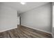 Unfurnished bedroom with neutral walls, wood-look flooring, and two large windows at 709 Jamescroft Way, Rolesville, NC 27587