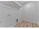 Walk-in closet with wood flooring and installed clothing rack at 709 Jamescroft Way, Rolesville, NC 27587