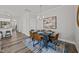 Contemporary dining area featuring a modern chandelier, table seating for six, and stylish decor at 709 Jamescroft Way, Rolesville, NC 27587