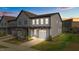 New two-story townhouse featuring a one car garage, gray siding, and manicured landscaping at 709 Jamescroft Way, Rolesville, NC 27587