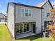 Back exterior of home with a patio, neutral siding, and an adjacent lawn at 709 Jamescroft Way, Rolesville, NC 27587