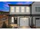 Charming two-story townhome with grey siding, white trim, and a one-car garage offers modern curb appeal at 709 Jamescroft Way, Rolesville, NC 27587