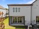 Back exterior showcasing the patio, neutral siding, and an adjacent lawn at 709 Jamescroft Way, Rolesville, NC 27587