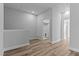 Upstairs hallway area with wood-look floors leading to bedrooms, bathroom and storage at 709 Jamescroft Way, Rolesville, NC 27587