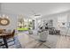 Open-concept living and dining area with stylish furnishings and abundant natural light from sliding glass doors at 709 Jamescroft Way, Rolesville, NC 27587