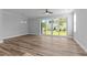 Spacious living room with modern floors and sliding glass doors, perfect for entertaining at 709 Jamescroft Way, Rolesville, NC 27587