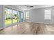 Bright living room featuring sliding glass doors to the yard and modern ceiling fan at 709 Jamescroft Way, Rolesville, NC 27587