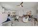 Open-concept living space with modern kitchen, dining area, and cozy lounge seating with stylish decor at 709 Jamescroft Way, Rolesville, NC 27587