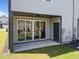 Covered patio area with large sliding glass doors leading to green backyard at 709 Jamescroft Way, Rolesville, NC 27587