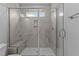 Walk in shower with a glass door, bench seat and tile surround at 709 Jamescroft Way, Rolesville, NC 27587