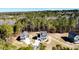 Panoramic aerial view showcasing the property's location amidst a lush forest landscape at 806 Roberts Rd, Sanford, NC 27332