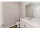 This bathroom features a white vanity, a sink, and a toilet at 806 Roberts Rd, Sanford, NC 27332