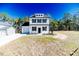 Charming two-story home with manicured lawn and white picket fence at 806 Roberts Rd, Sanford, NC 27332