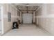 View of the garage with concrete flooring and a metal garage door at 806 Roberts Rd, Sanford, NC 27332