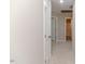 View of an upstairs hallway with carpet, a white door, and view of a bathroom at 806 Roberts Rd, Sanford, NC 27332